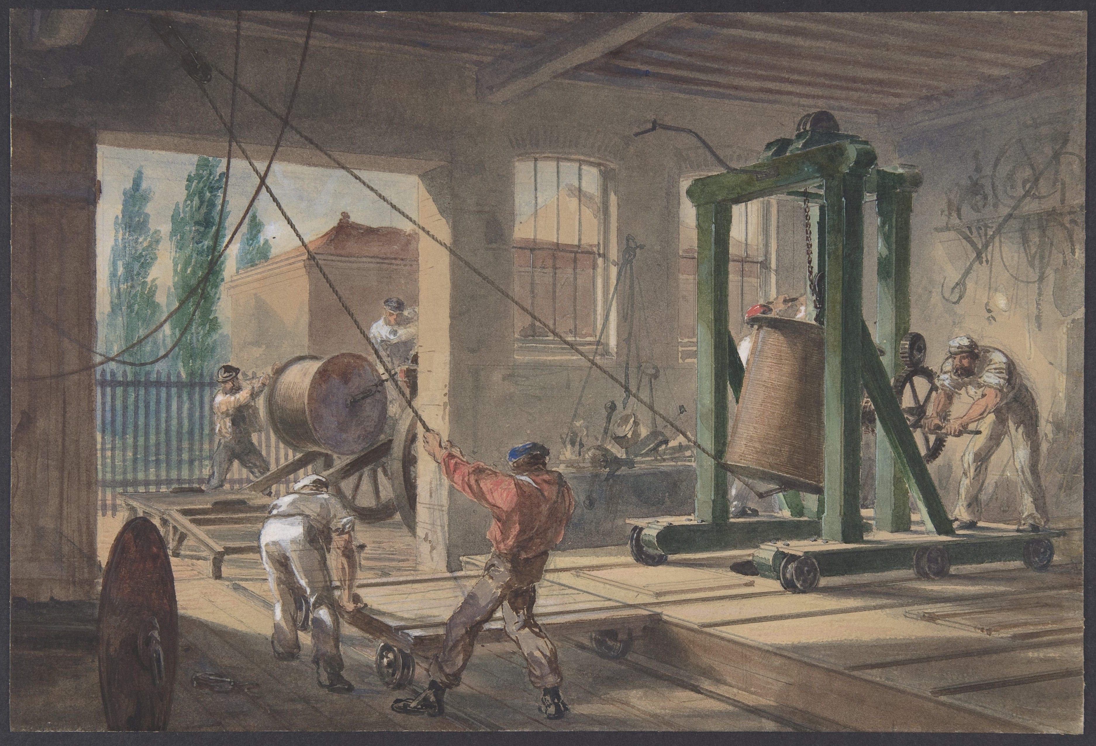 Factory workers moving large reels with ropes and a wheeled gantry at Greenwich