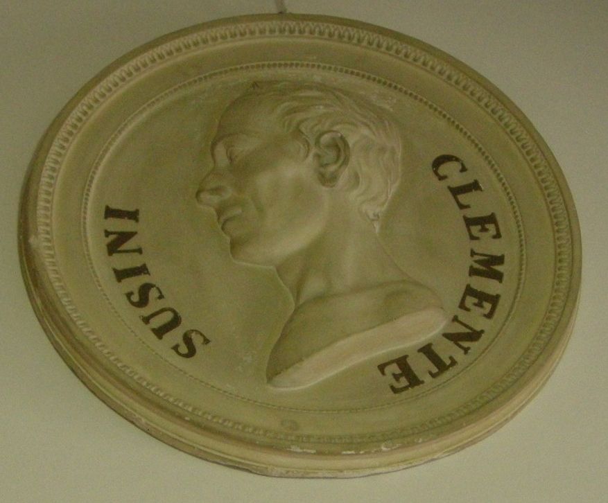 A profile relief of Clemente Susini, surrounded by his name.
