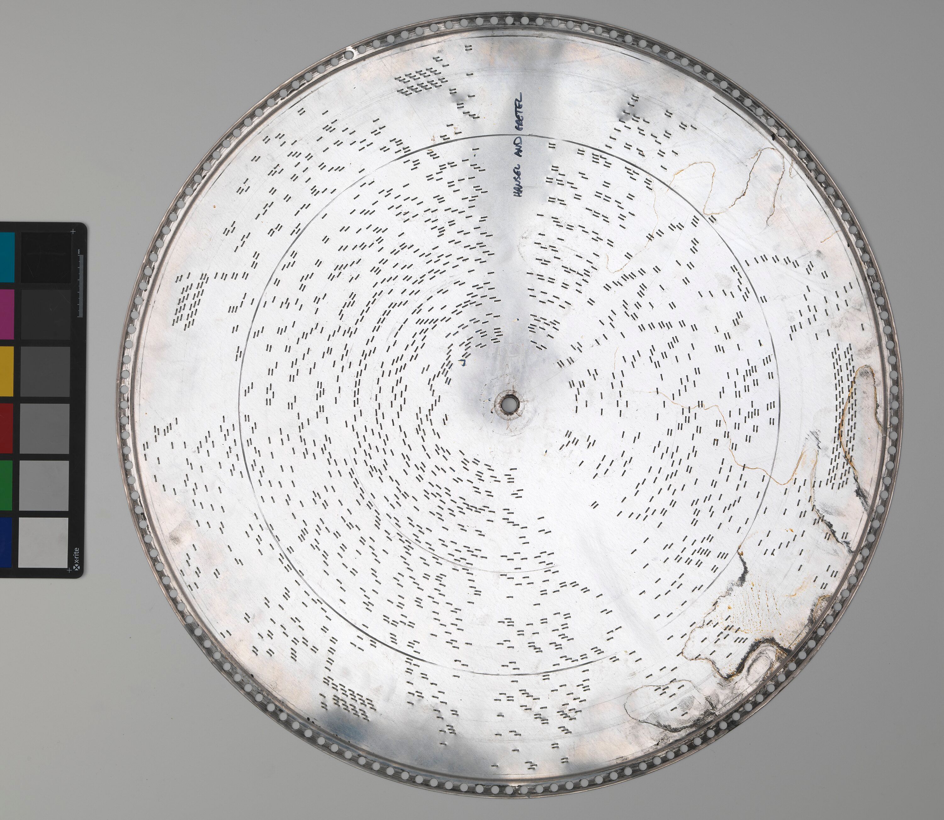 Projecting steel tongues on the back of the same music disc
