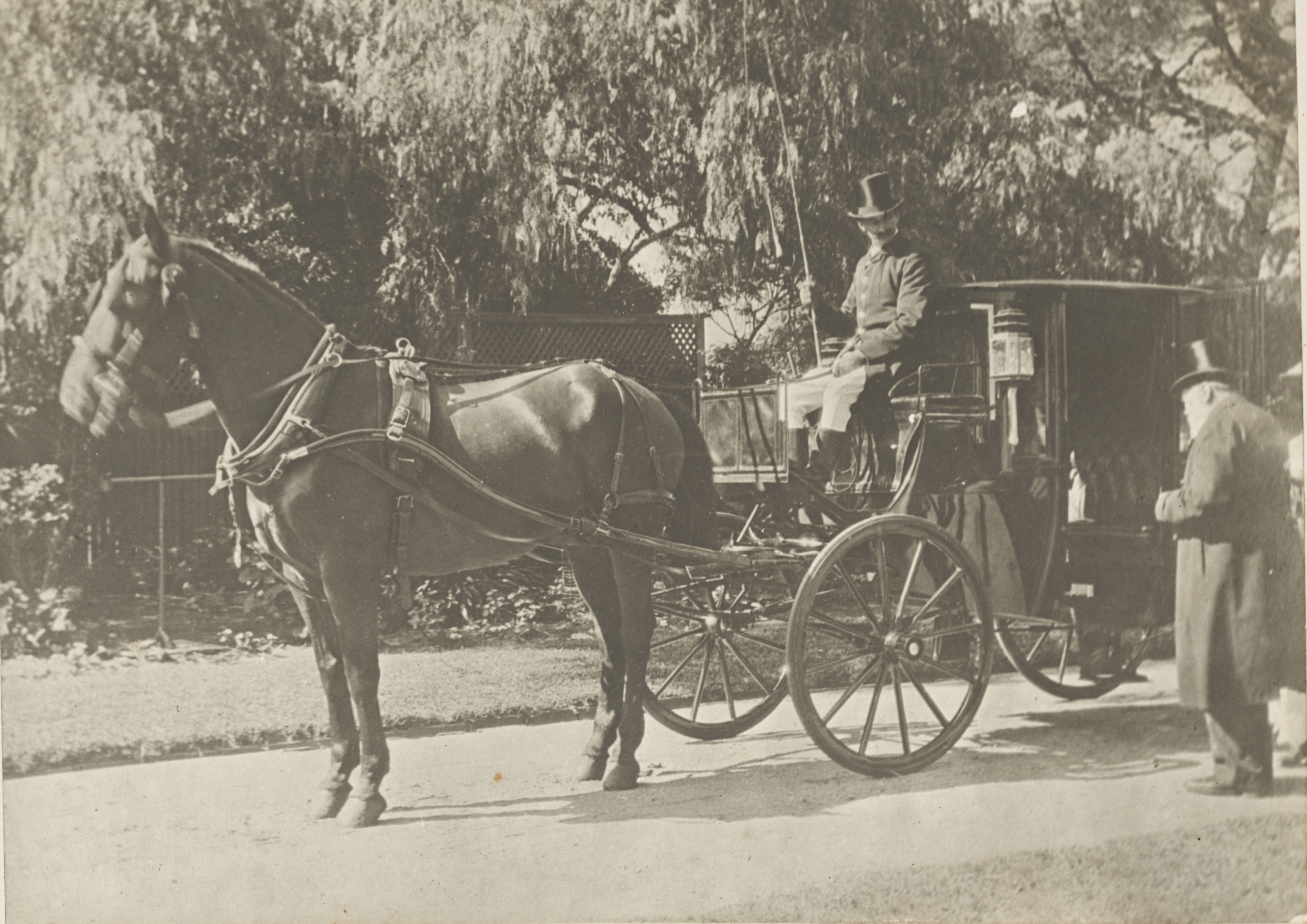 A horse-drawn carriage and E.W. Cole leaving home for business