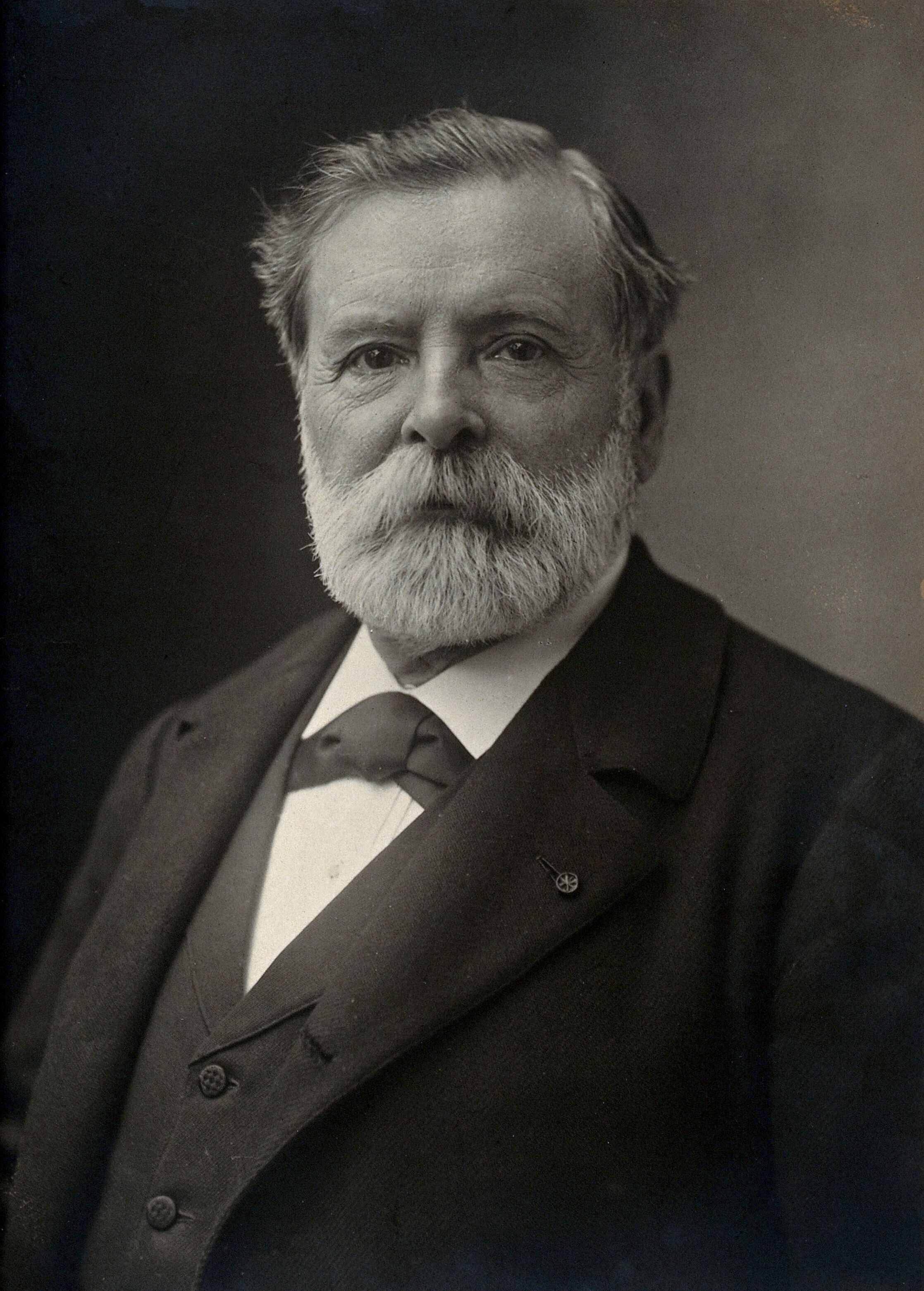 Étienne-Jules Marey in a dark coat and tie, with a grey beard and moustache.