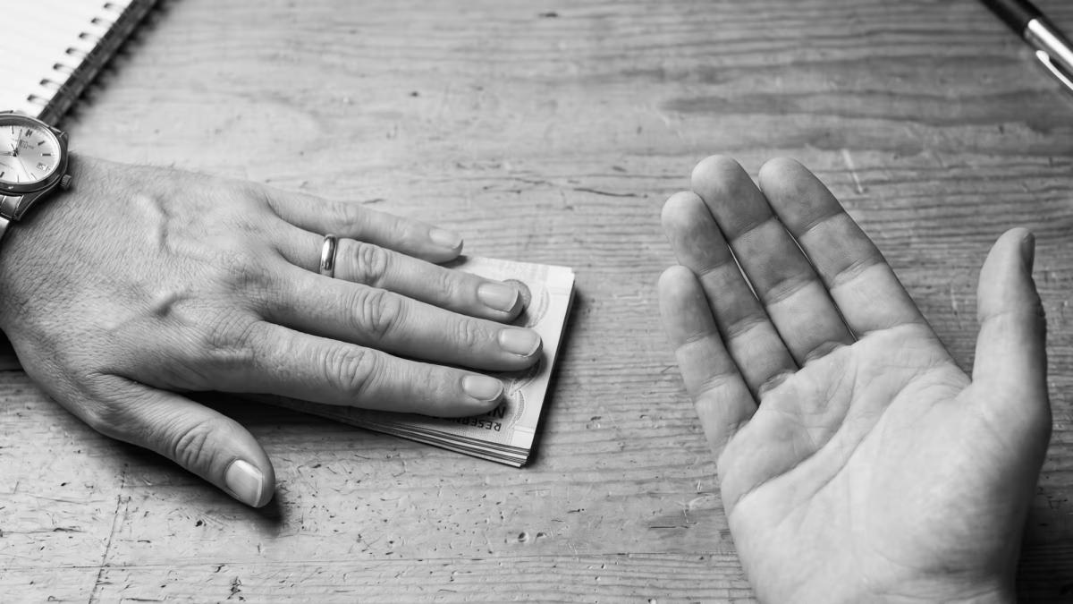 Subcontractor reviewing a construction contract highlighting the illegality of pay-when-paid clauses in New Zealand.
