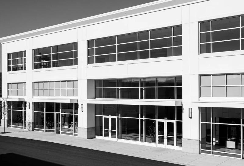 Modern commercial property with glass shopfronts and entrances