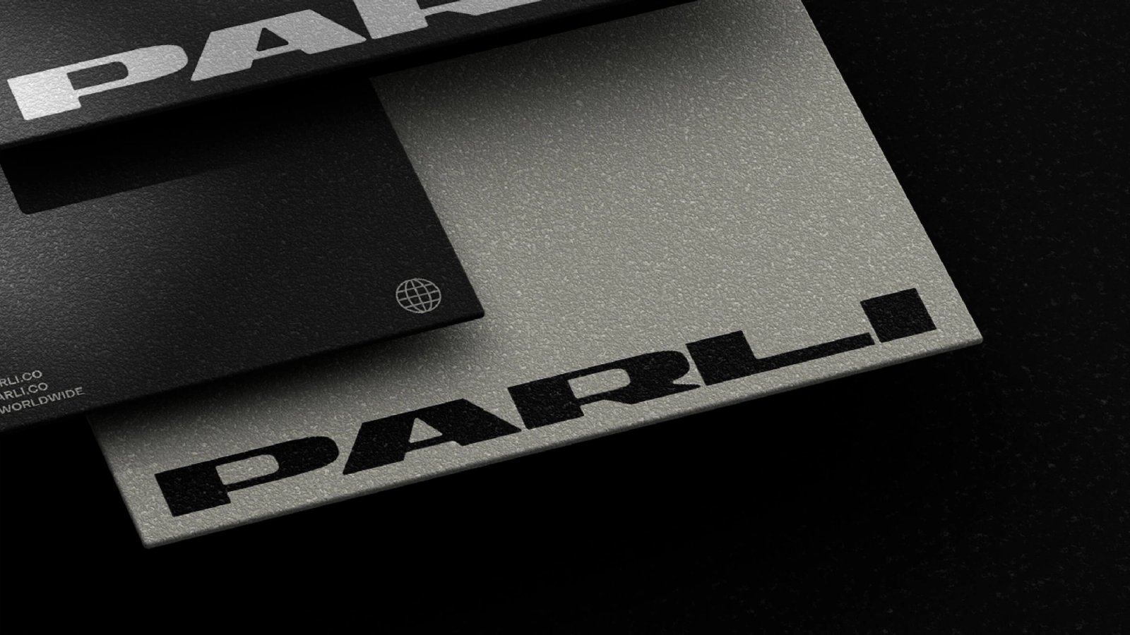 Parli business cards on a black background