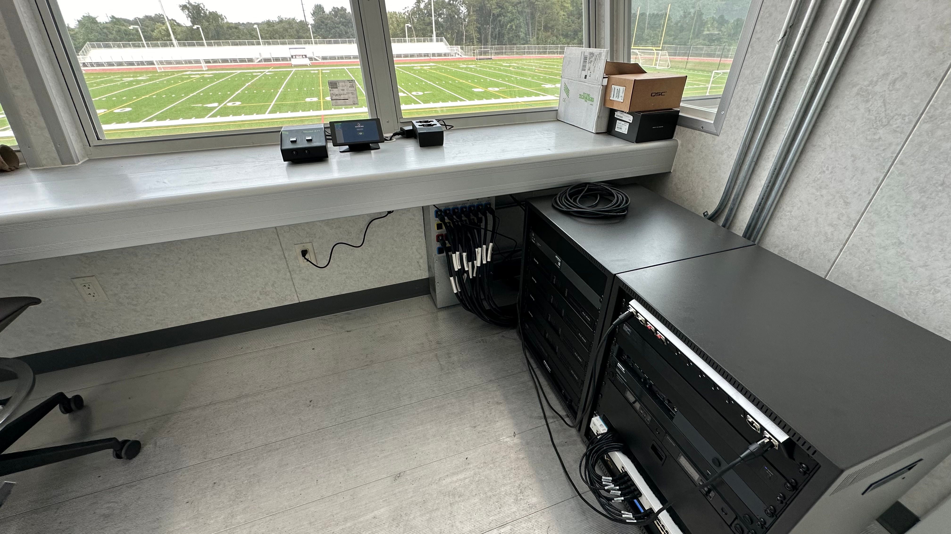 Announcers Booth with two equipment racks to the side