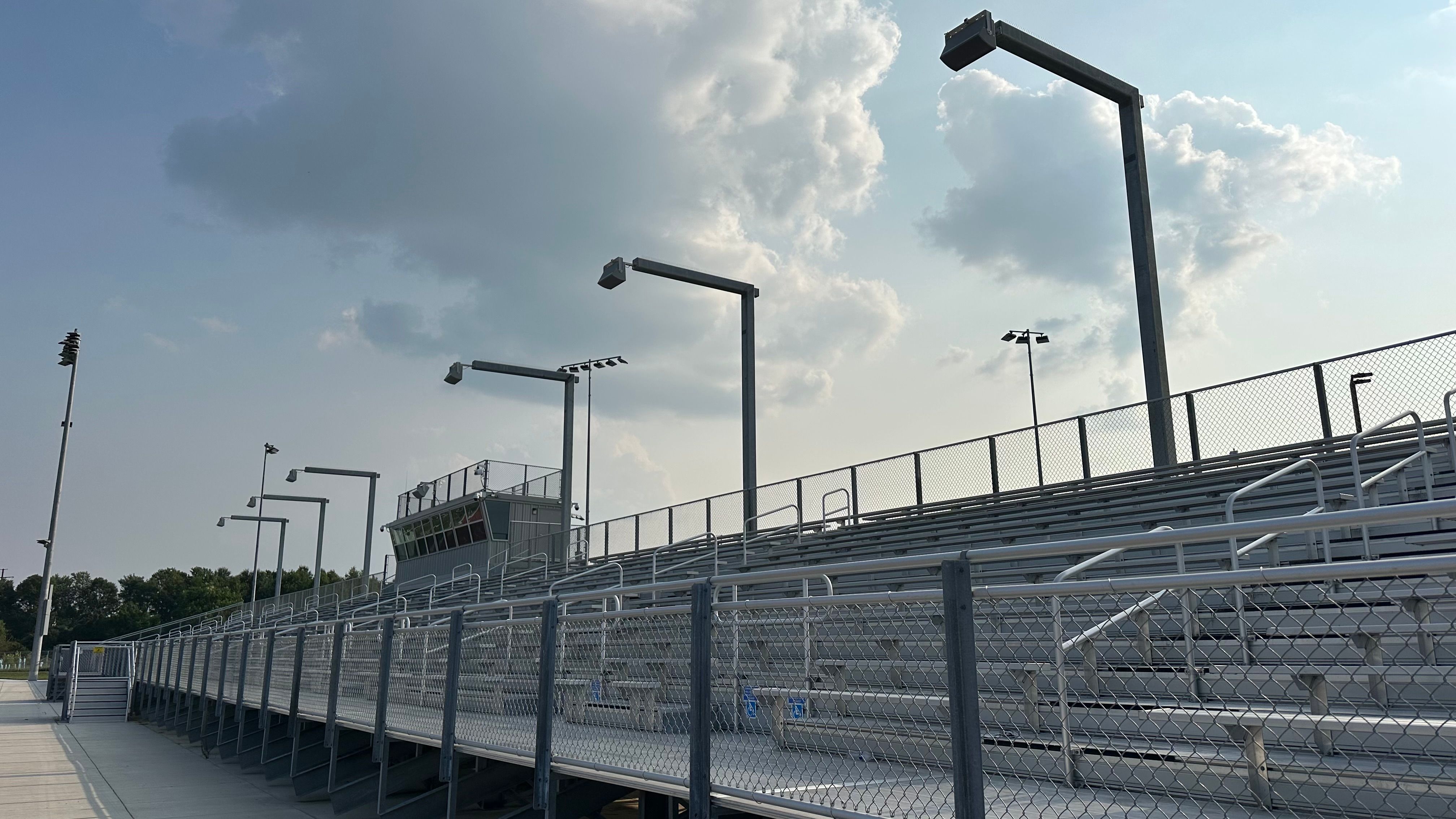 Speakers over metal bleachers at a stadium