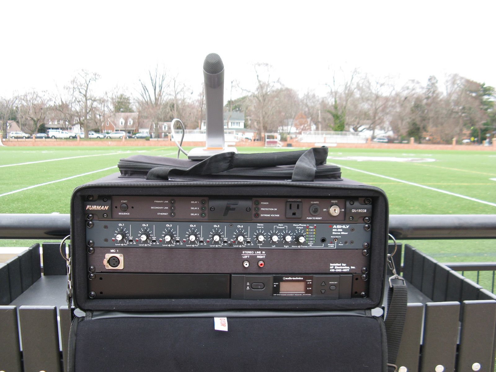 Portable sound rack with microphone sitting on top
