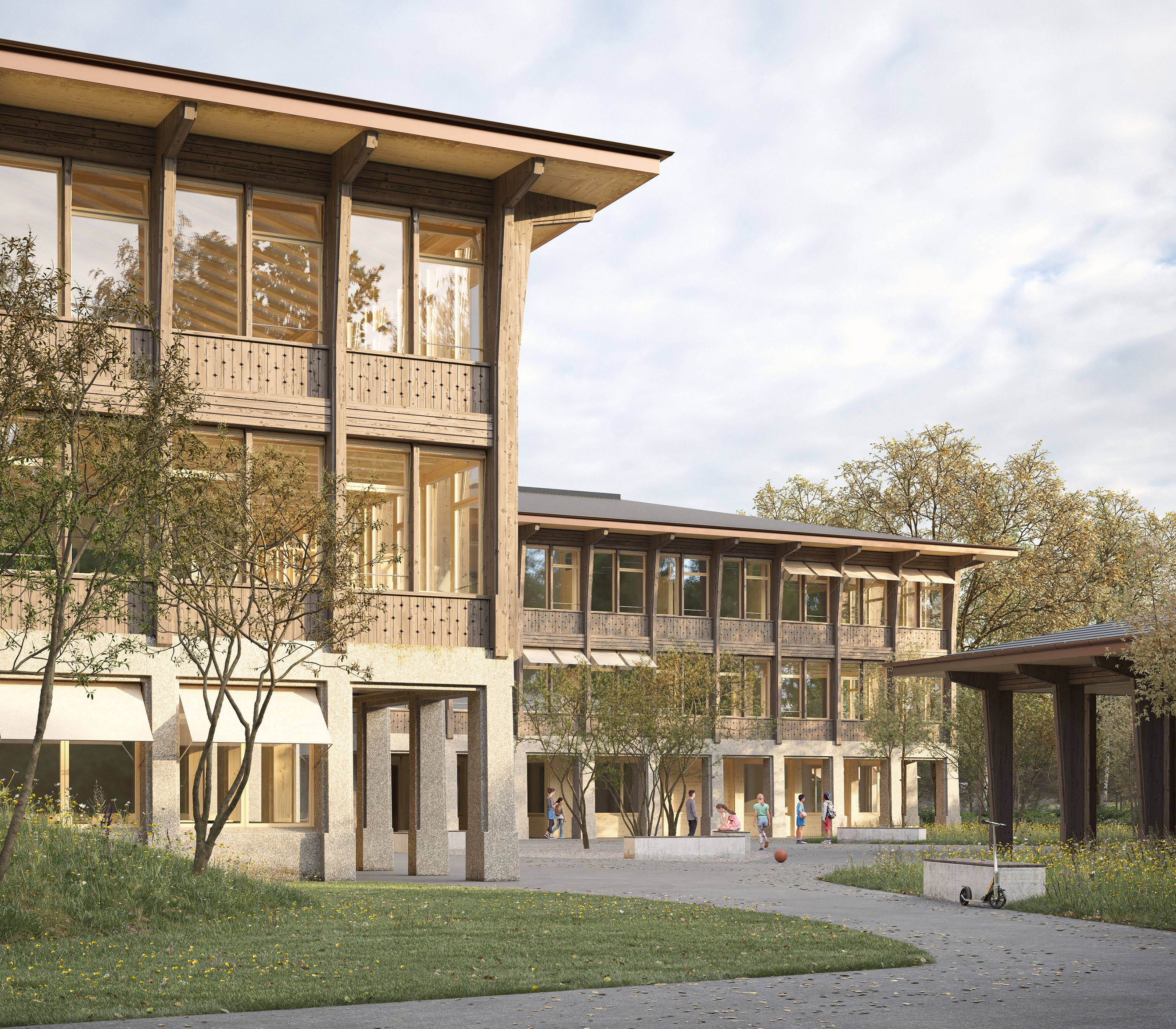 Holzfassade auf muralem Sockelgeschoss beim Schulhaus Kandermatte in Thierachern