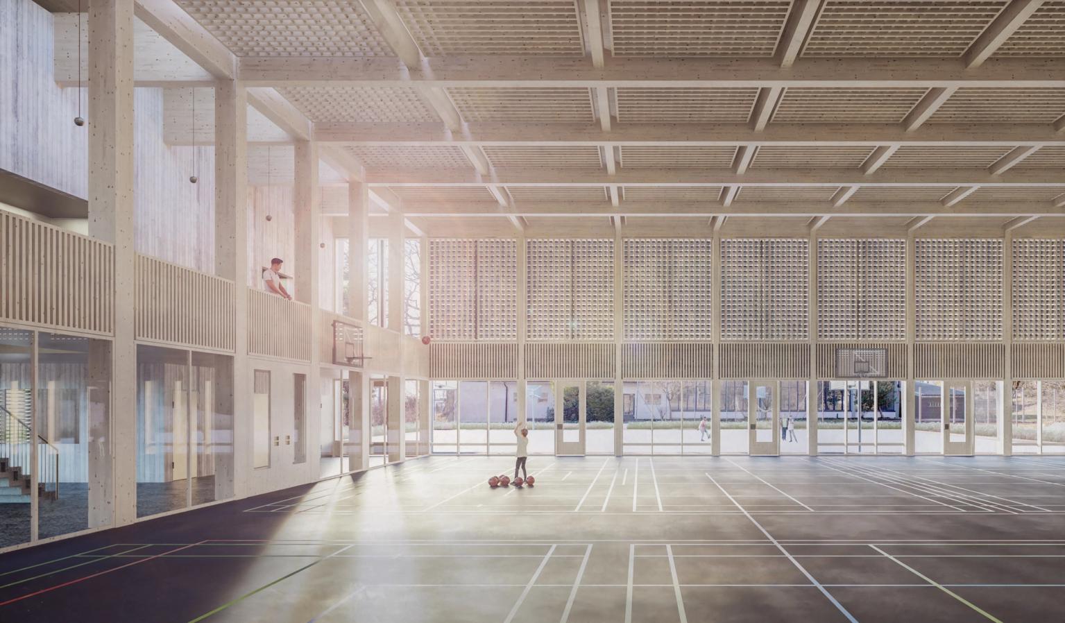 Innenansicht der Doppelsporthalle mit Zuschauergallerie im Schulhaus Kastels in Grenchen