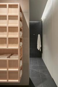 Marshmallow bathroom undressing zone looking to shower