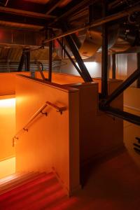 Orange staircase leads up to the mezzanine