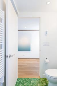 Bathroom with bright concrete floor tiles