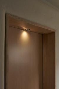 Nightlight built into the threshold of the guest bathroom, illuminates the way for the Grandparents’ many visitors