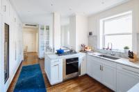 Two back to back kitchens in separate units became, when combined, a dine-in kitchen