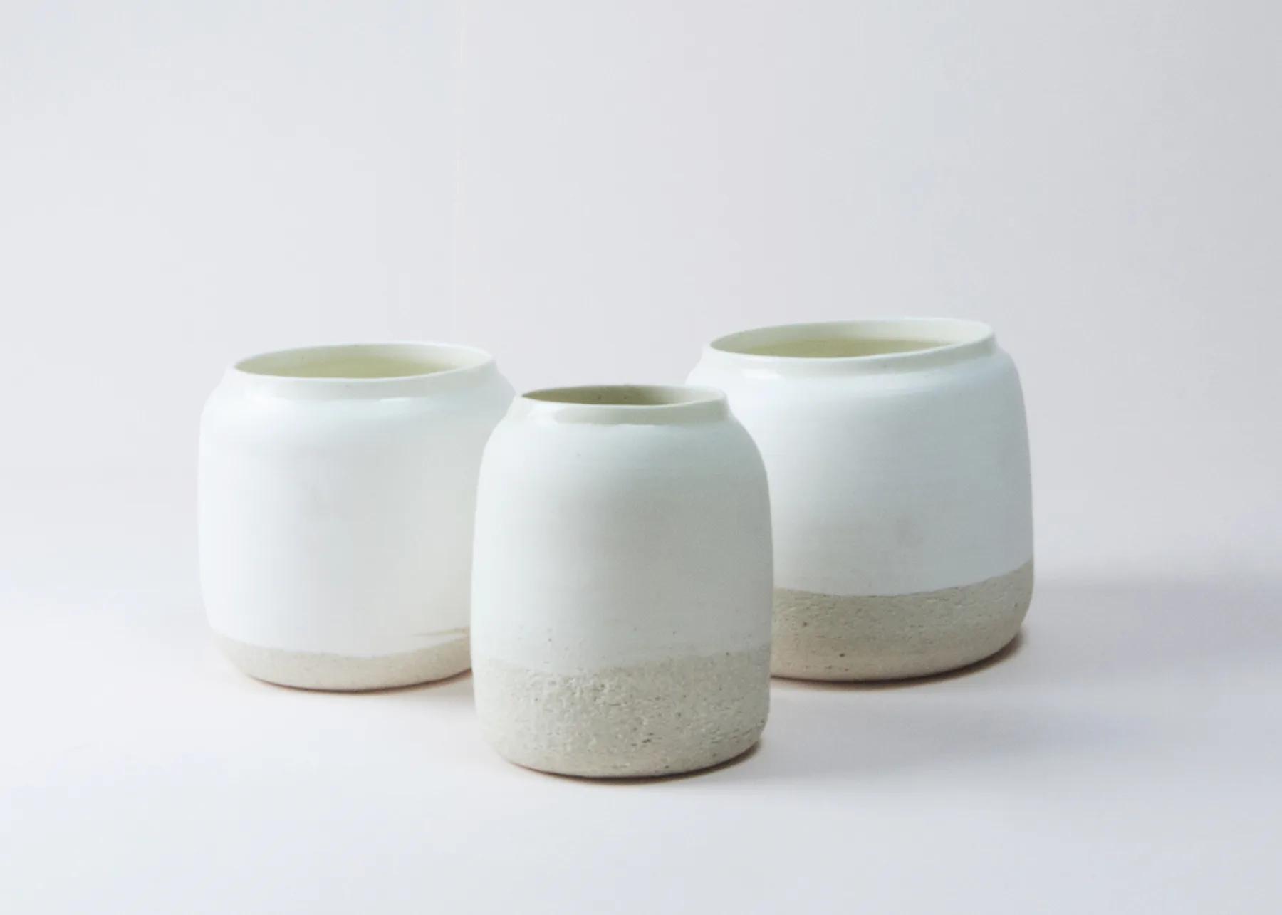 Three Nude vessels made from buff and raku clay combinations