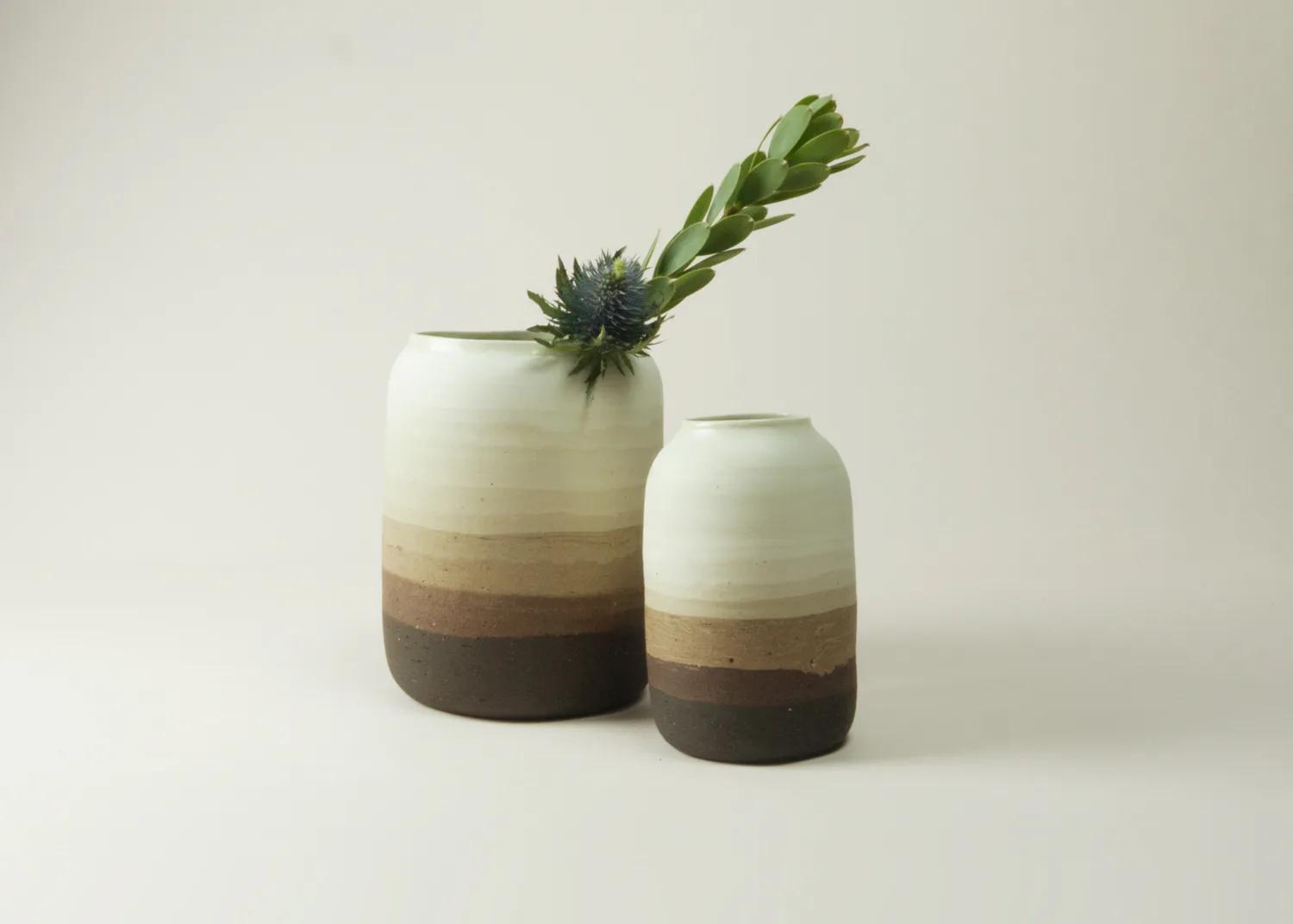 Two brown Nude vessels revealing contrasting clay bodies