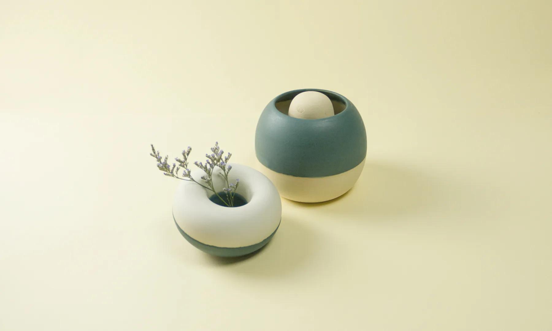 A pair of green Restless vessels shown on opposite usable sides