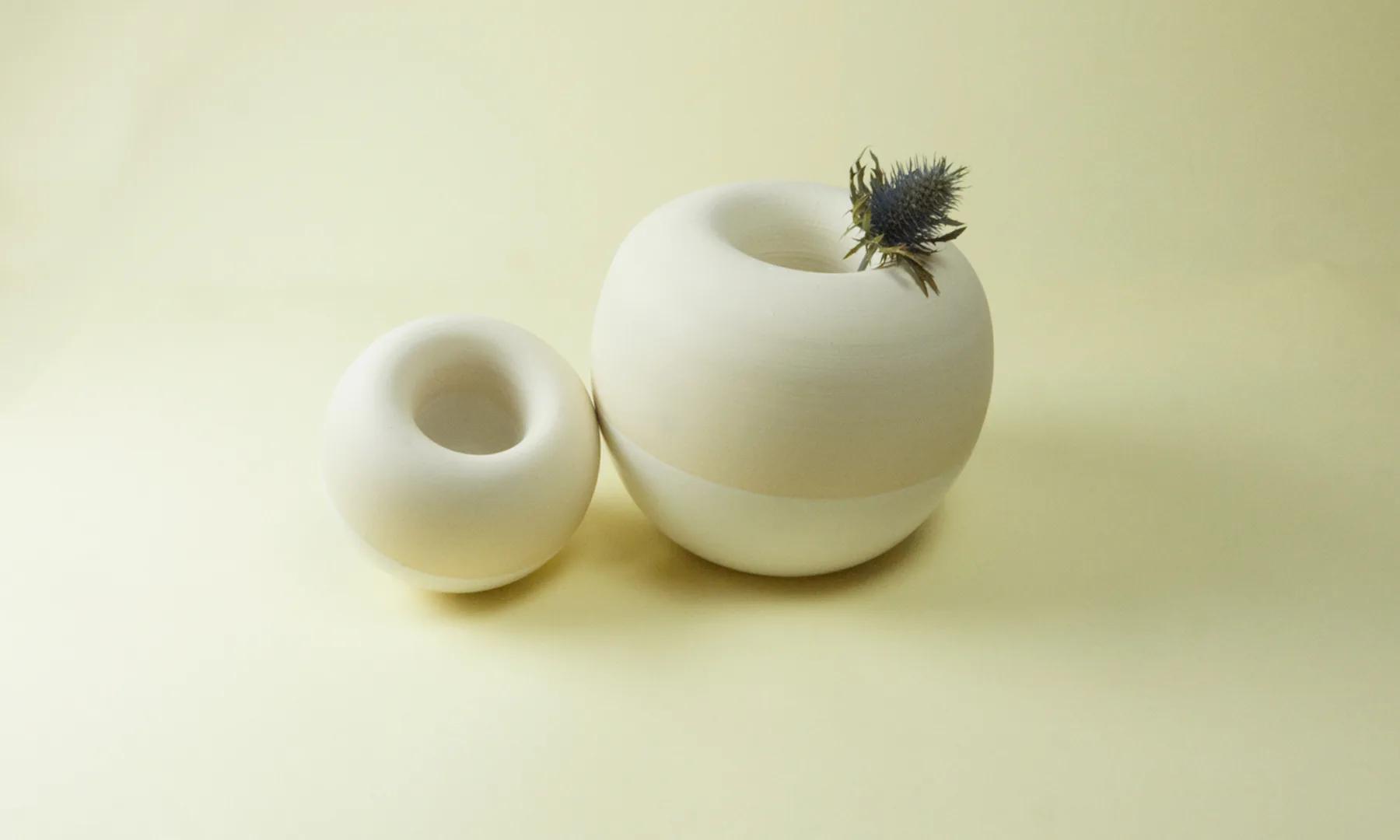 A yellow Restless vessel shown upright and inverted