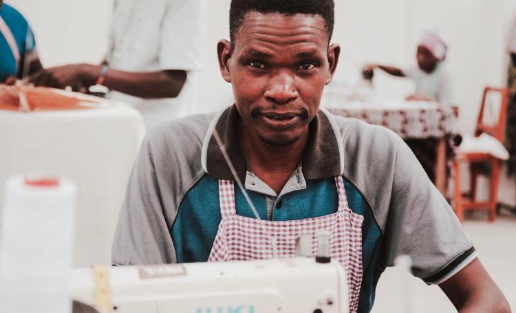 Man working at sewing machine