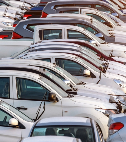 Aerial view of rows of vehicles parked