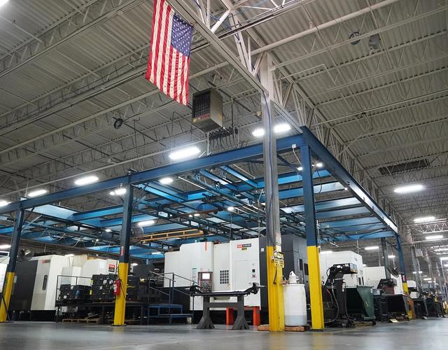 High-volume production CNC machining facility floor with automated manufacturing cells at Westport Machining