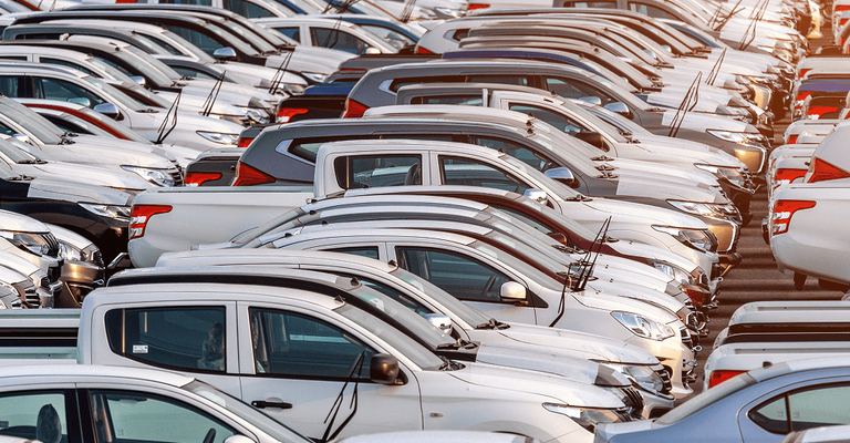 Aerial view of rows of vehicles parked