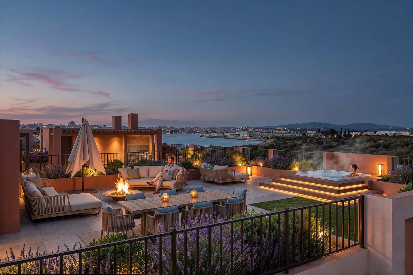 Roof terrace with a hot tub, outdoor fireplace and seating at dusk, overlooking the river.