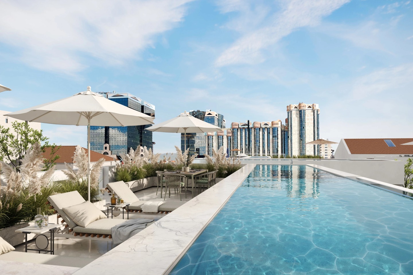 Rooftop pool with sun loungers, parasols and the Lisbon skyline on the horizon.