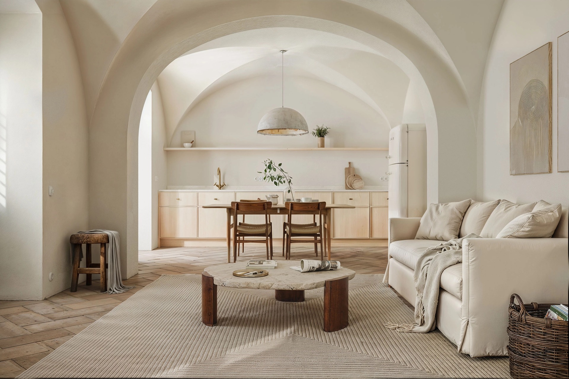 Living room under white vaults with the kitchen beyond, dining table and sofa, at N6 in Boliqueime.