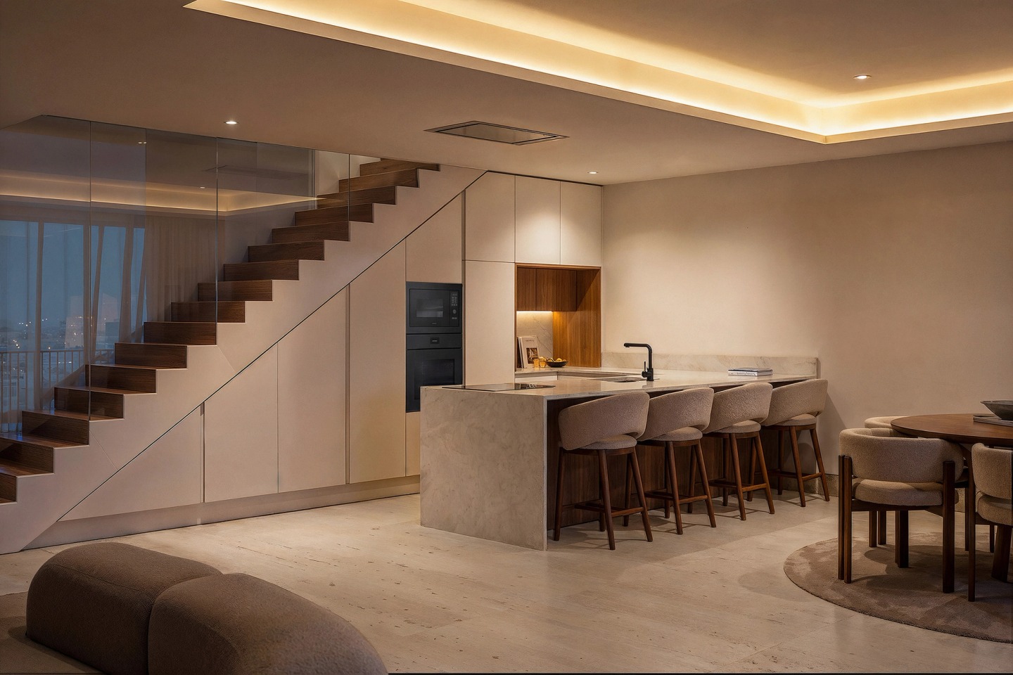 Kitchen with an island and a timber staircase in an Edifício Bocage duplex apartment.