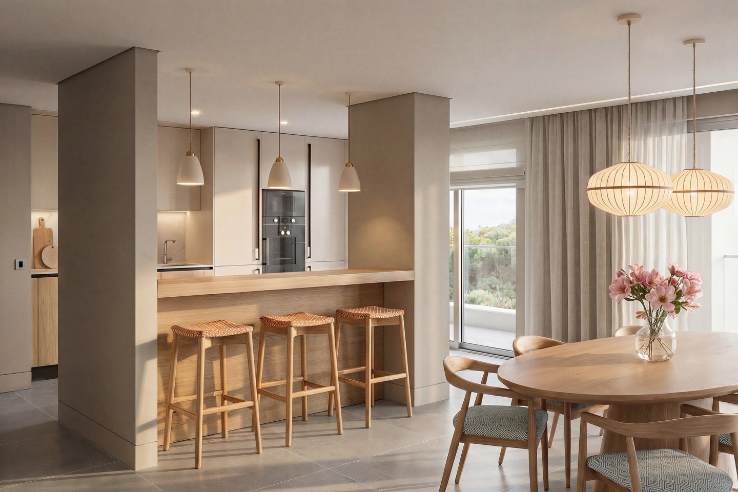 Kitchen with a timber counter, tall stools and a round dining table by the window.
