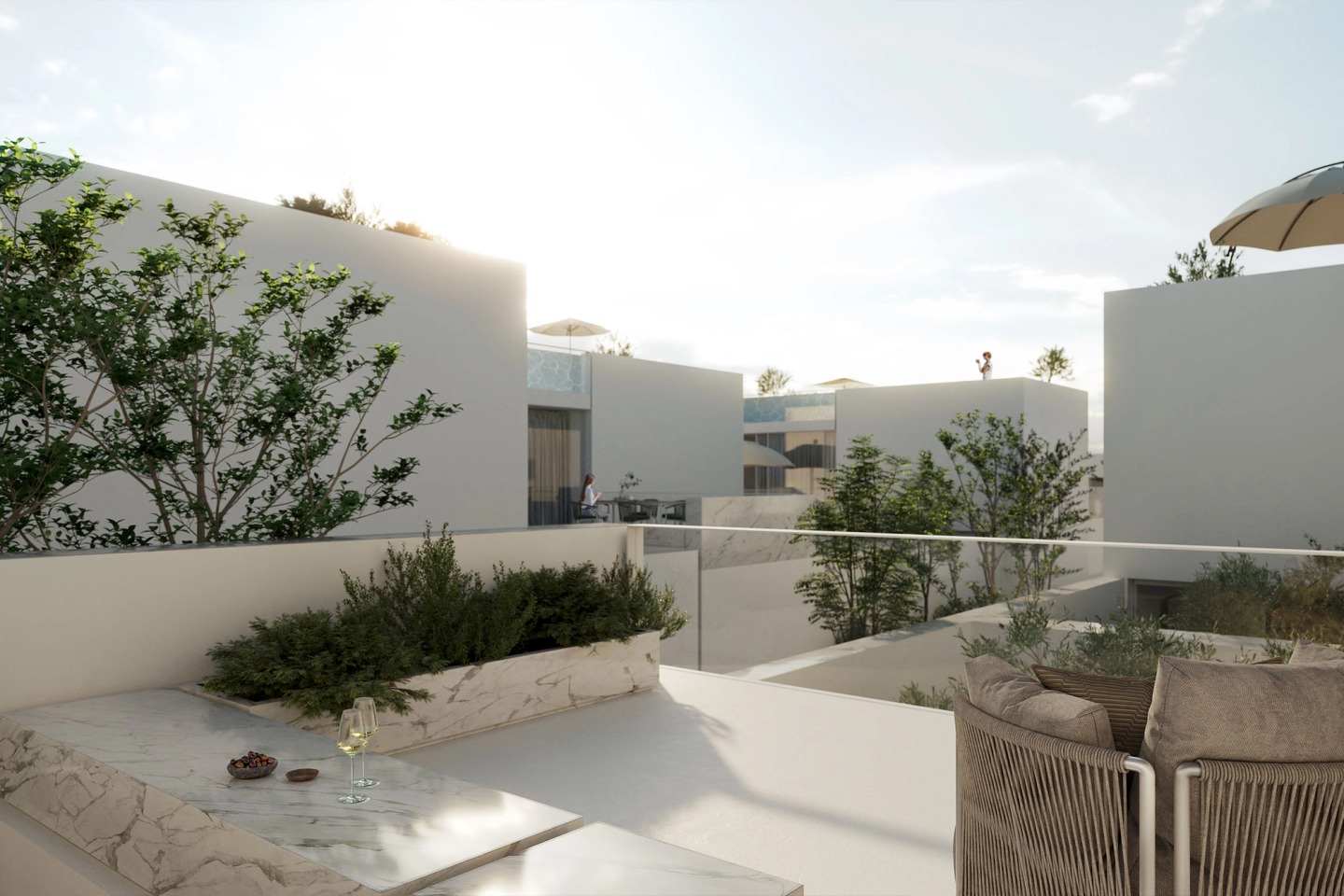 Private terrace with a planter and white walls, among the Secret Garden Villas houses.