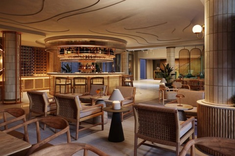 Bar lounge with timber and rope armchairs, low tables and the circular counter beyond.