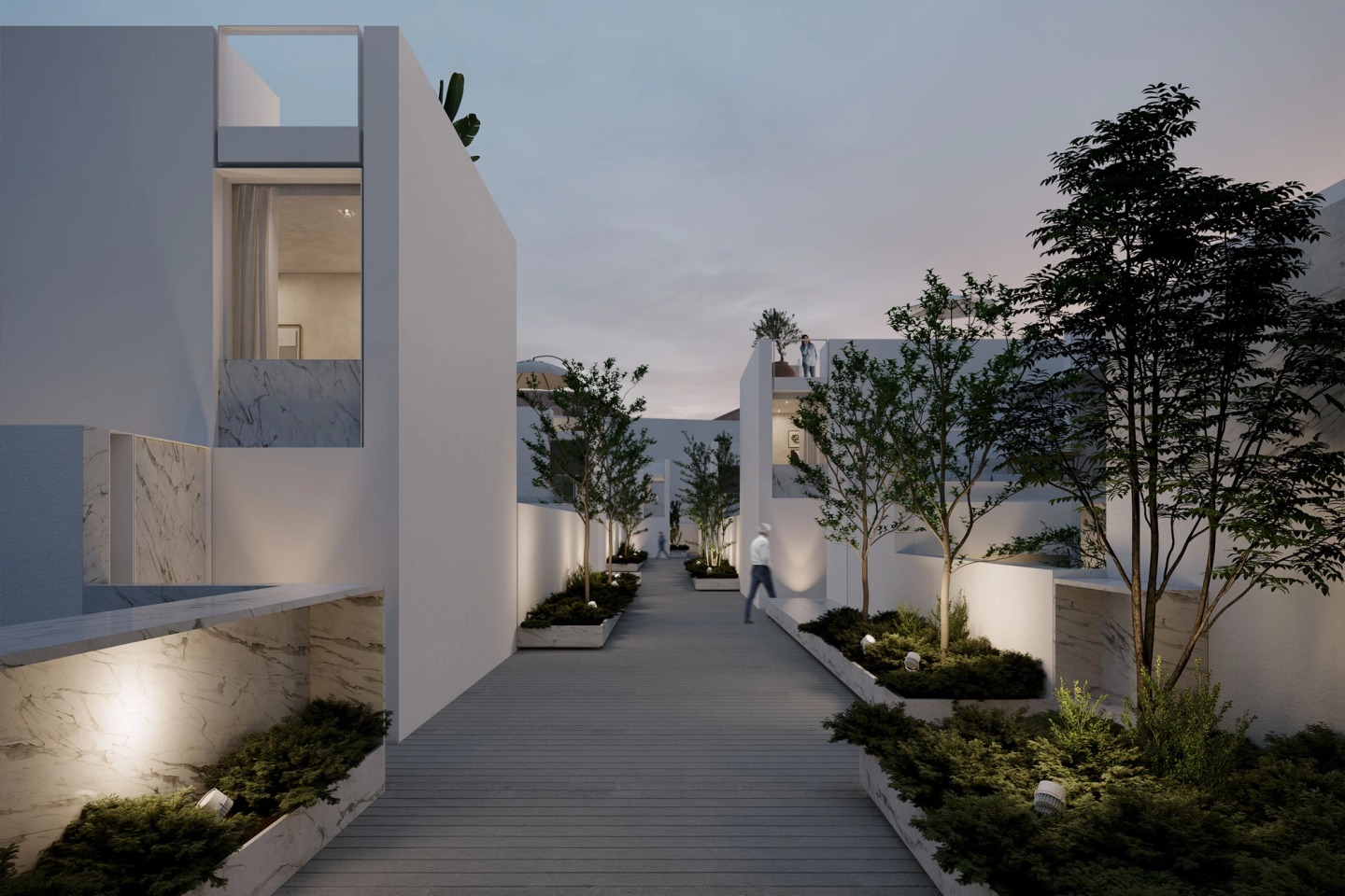 Landscaped inner street of Secret Garden Villas at dusk, with trees and low-level lighting.
