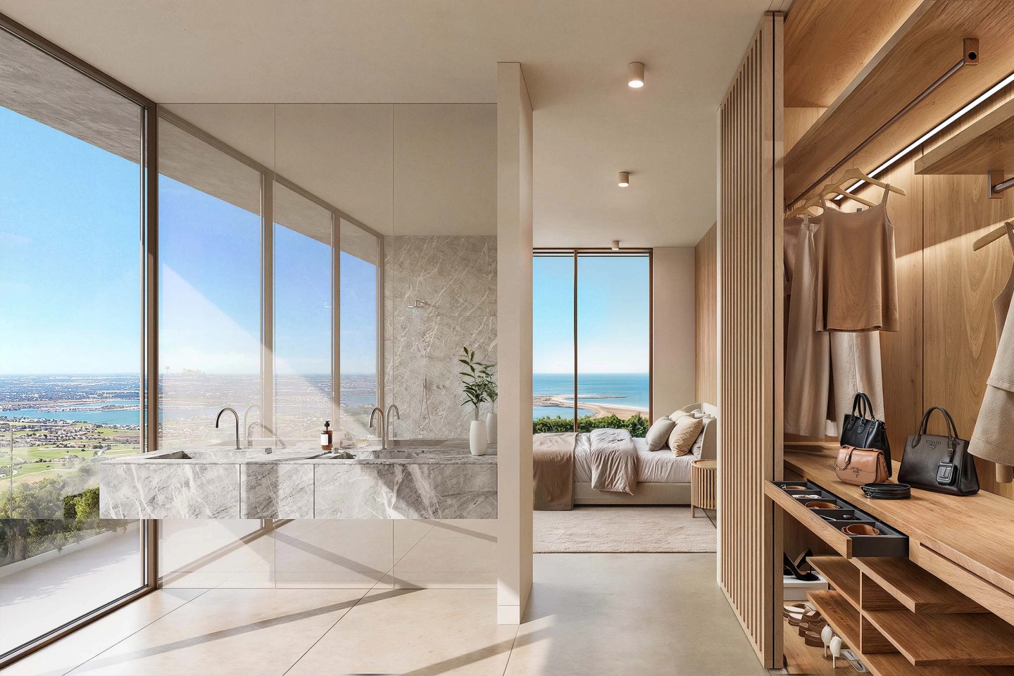 Suite with a timber walk-in wardrobe, marble bathroom and windows looking out to sea.