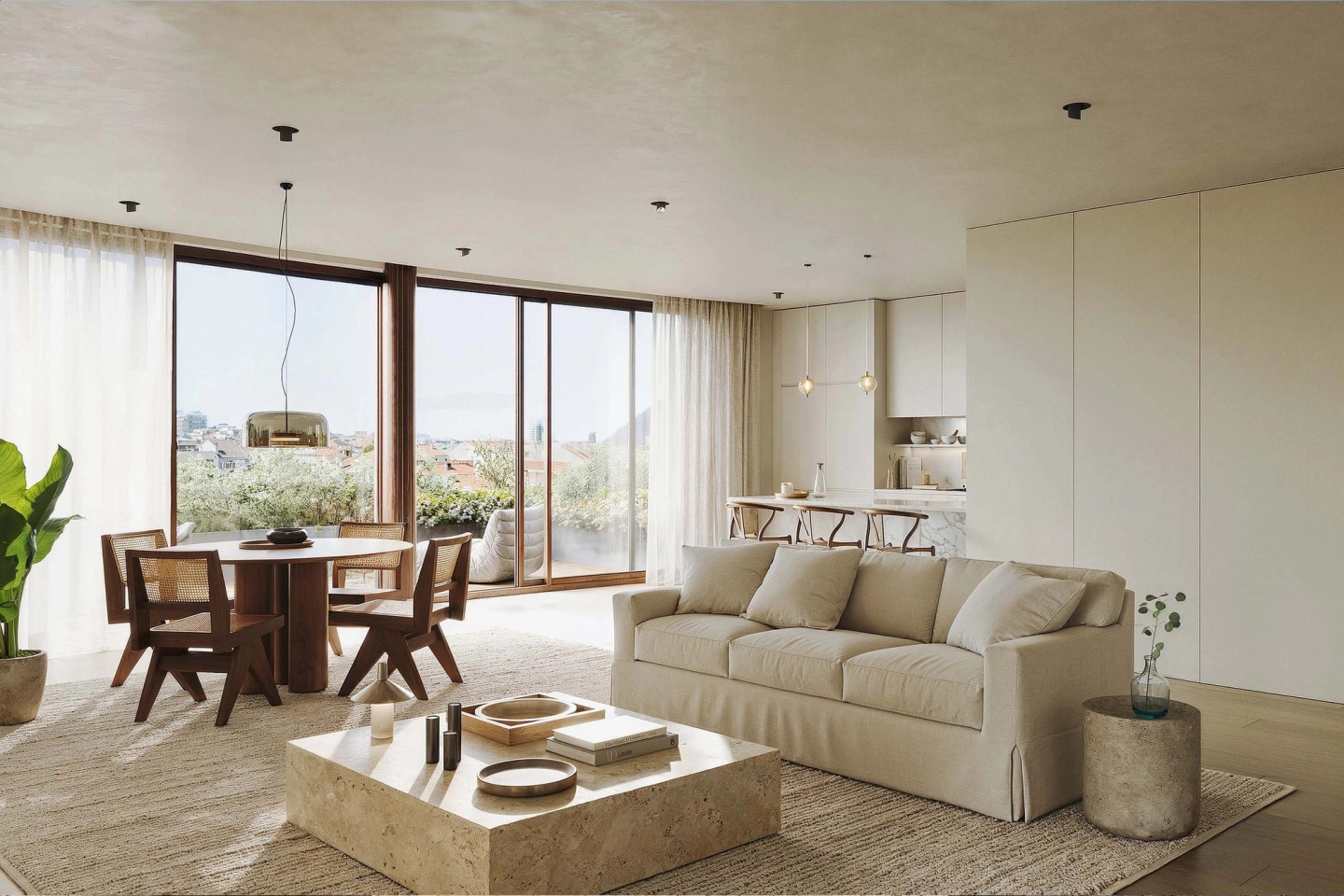 Living room with a light sofa, round dining table and wide windows onto the balcony, at 62 The Flat Gardens.