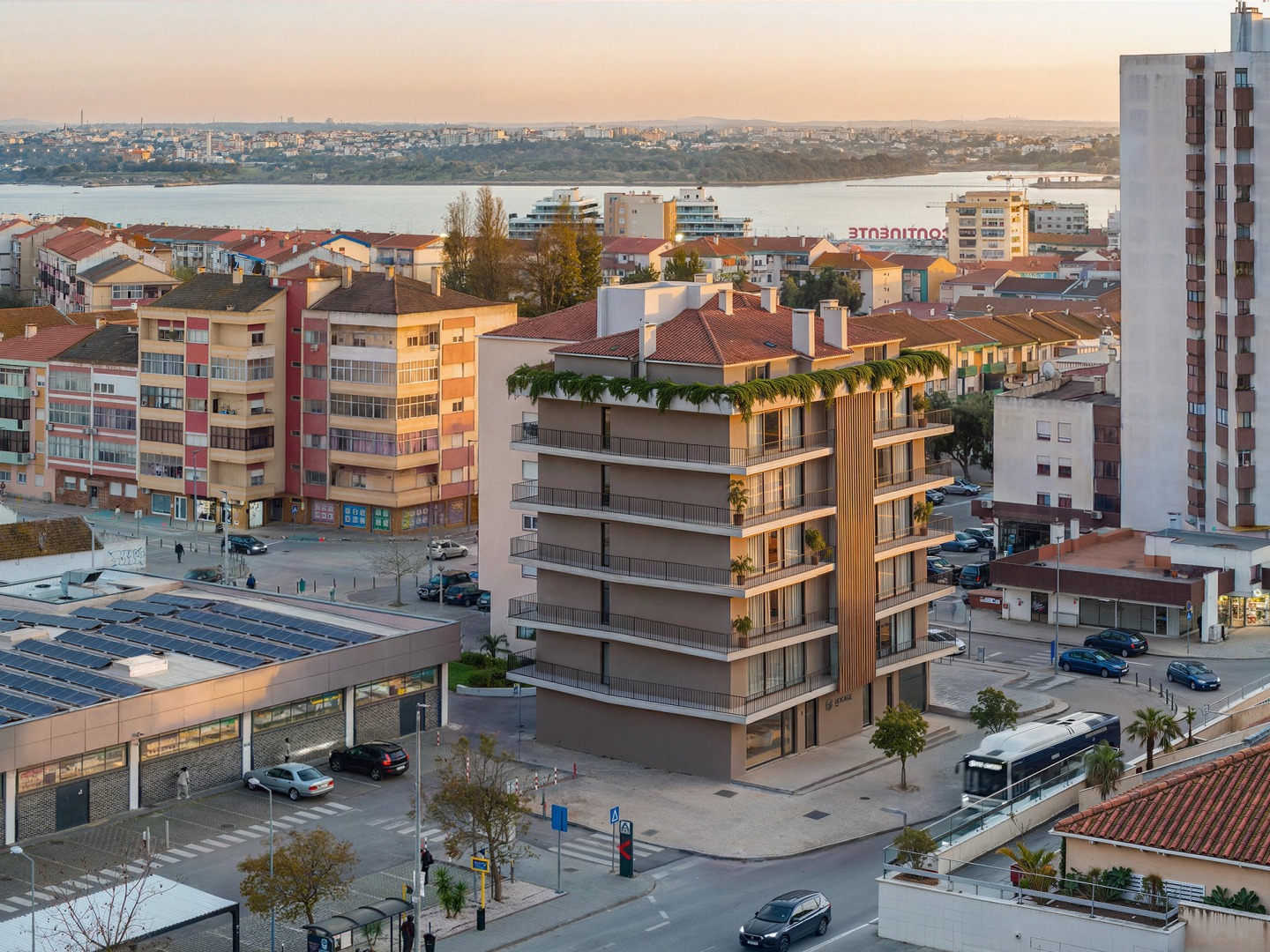 Aerial view of Edifício Bocage in Barreiro with the Tagus river beyond.