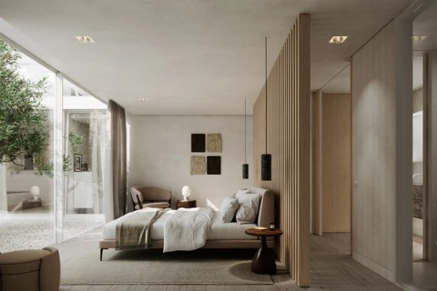 Bedroom with a timber slat partition and a glazed wall onto a courtyard with trees.