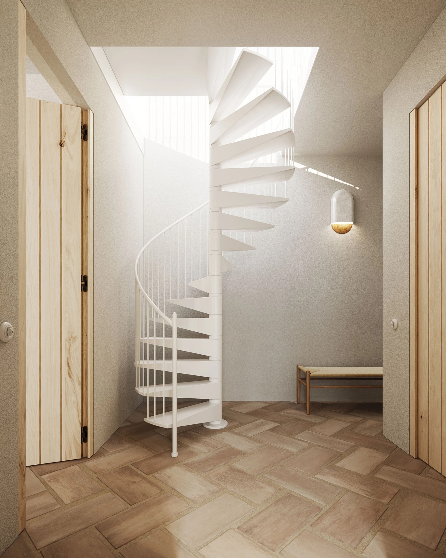 White spiral staircase lit by a skylight, with a herringbone floor.