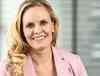 Preview of: Smilende blond kvinde i lyserød blazer og hvid bluse
