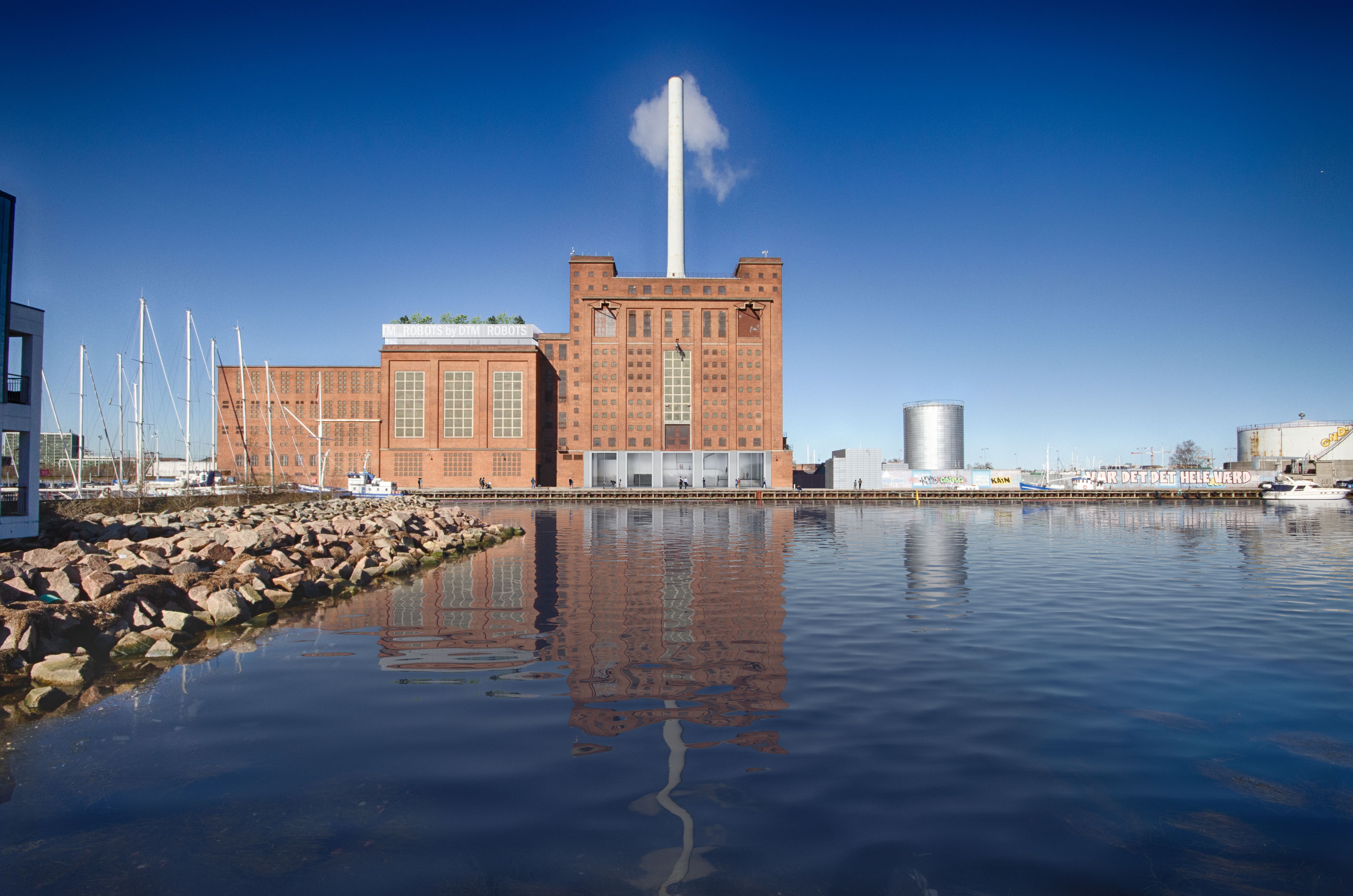 Preview of: Luftudsigt over havneområde med marinaer, bygninger, jernbane og fodboldbaner