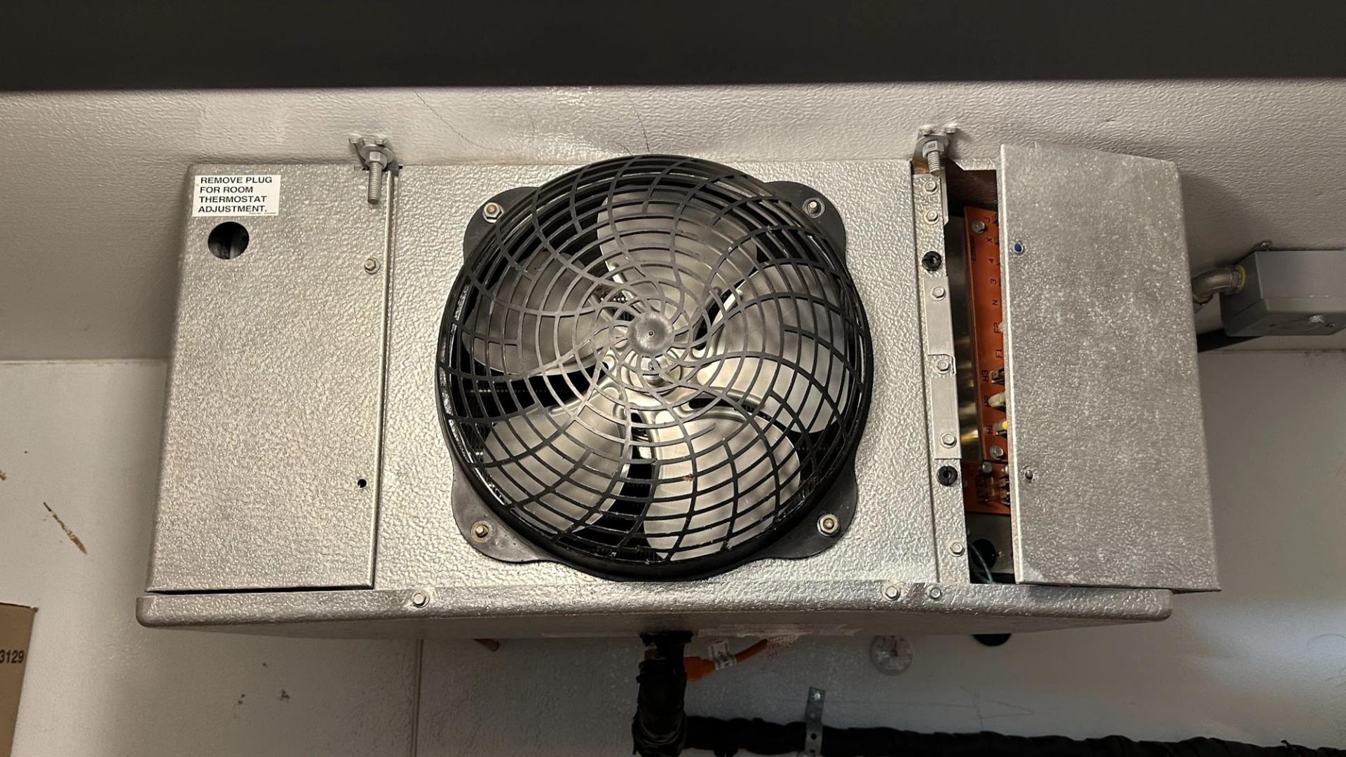 Art HVAC Technician Servicing a Commercial Walk in Cooler Evaporator at a NYC Restaurant Kitchen Refrigeration Site