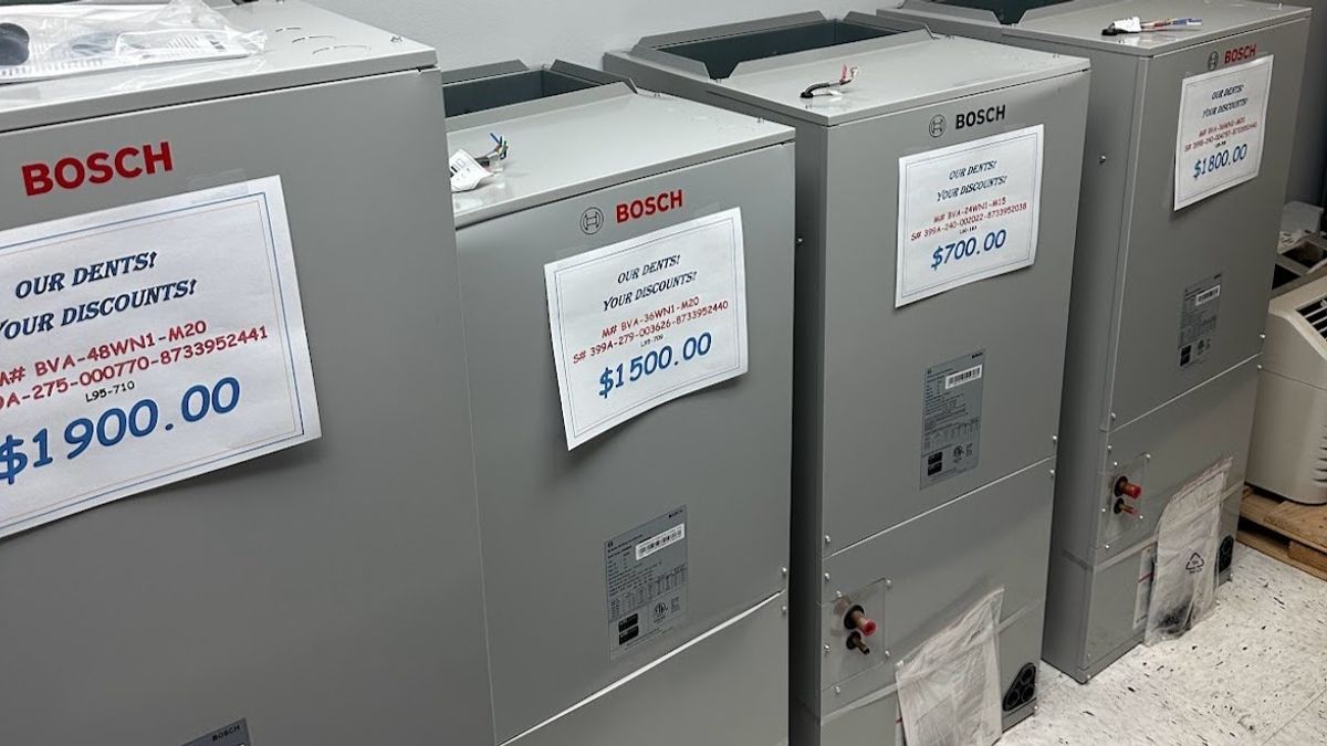 Art HVAC Technician Installing a Bosch High Efficiency Heat Pump System at a New York City Residential Building Site