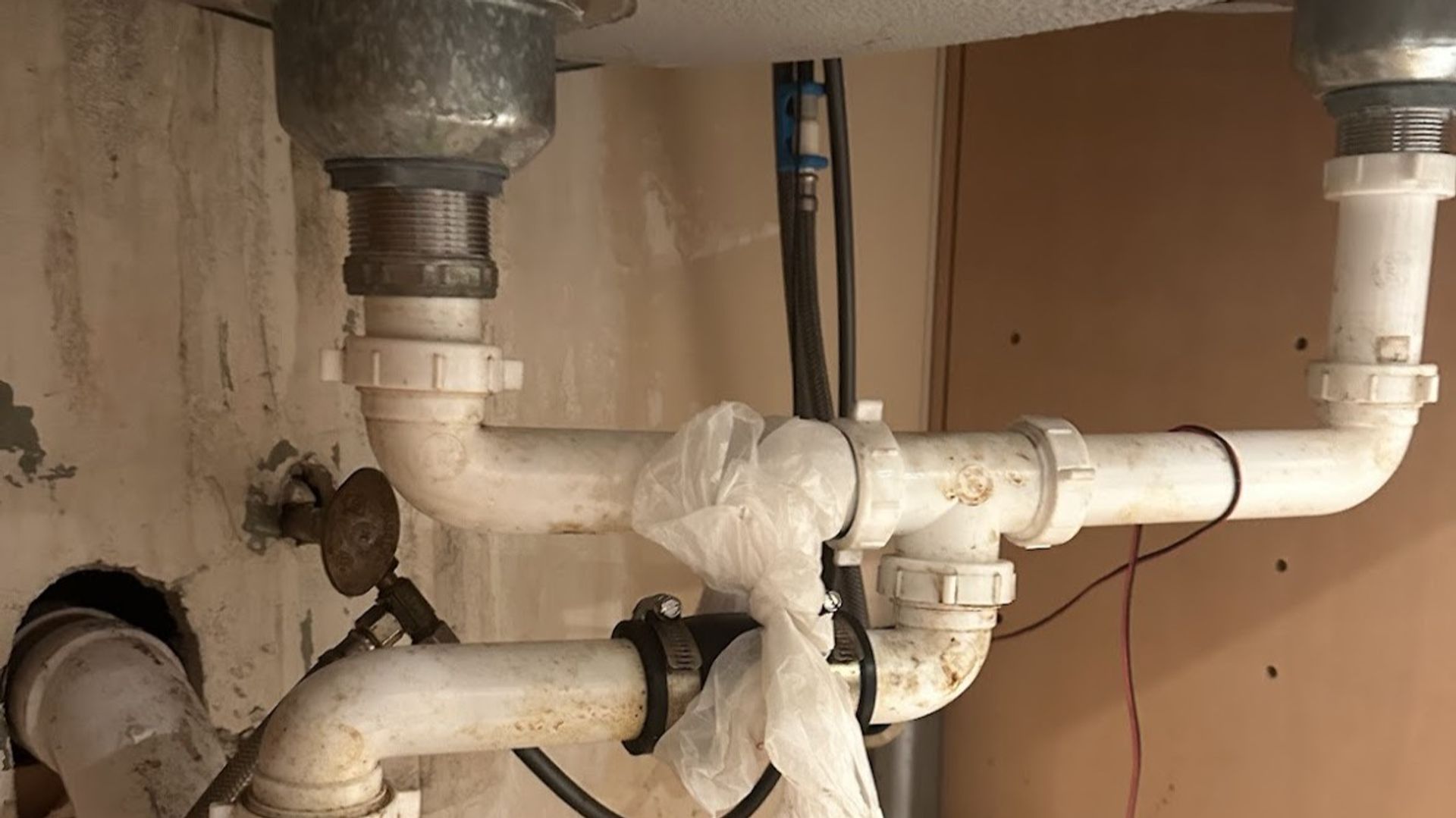 Art HVAC Plumber Repairing a Commercial Supply Line Leak in a NYC Office Mechanical Room Plumbing Service Call