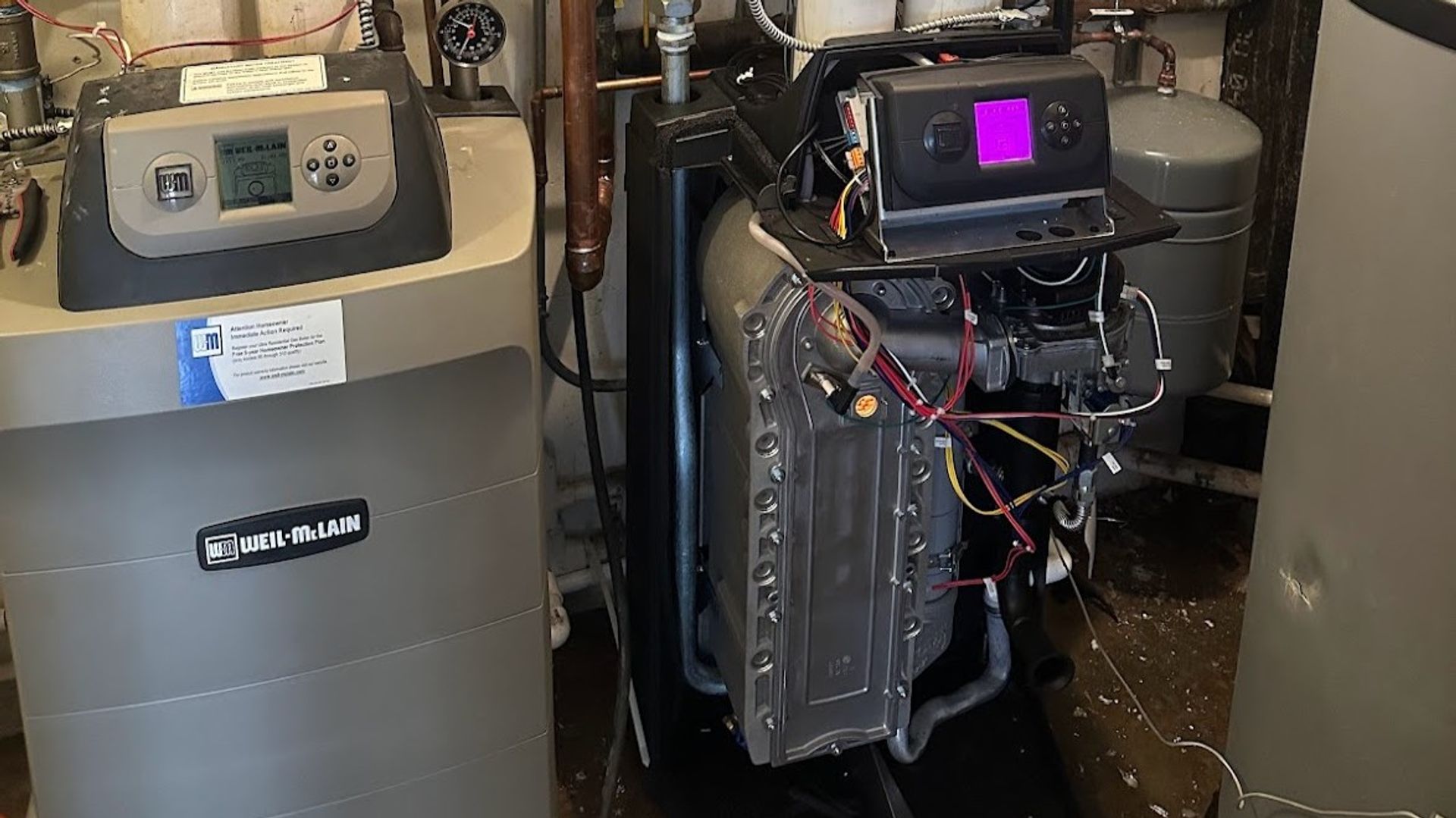 Art HVAC Technician Commissioning a New High Efficiency Commercial Boiler in a NYC Mechanical Room Boiler Service