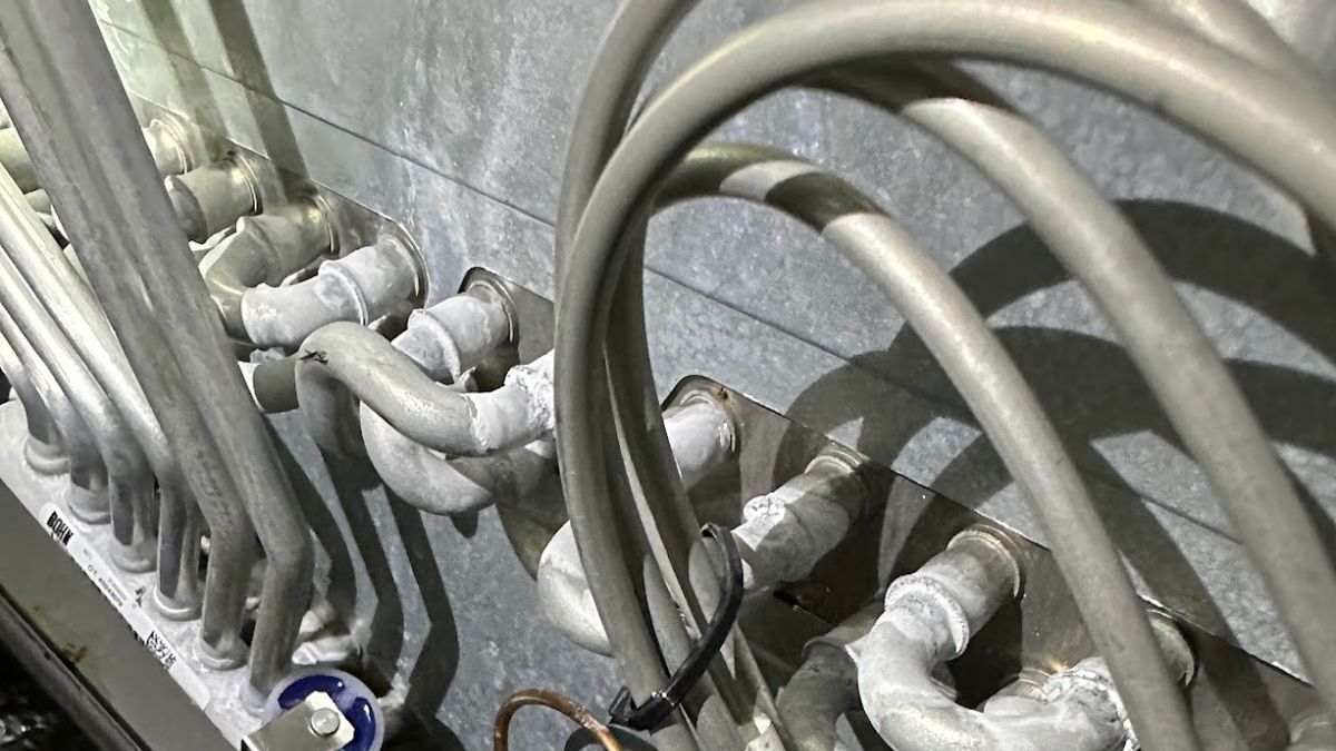 Art HVAC Technician Servicing a Traulsen Reach in Freezer Cabinet at a NYC Restaurant Commercial Kitchen Property