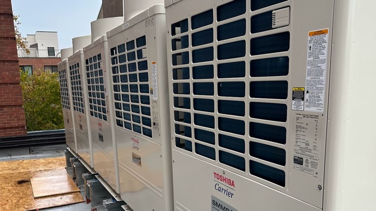 Art HVAC Team Commissioning a New Carrier Commercial Rooftop HVAC Unit on a Manhattan Office Building Project Site