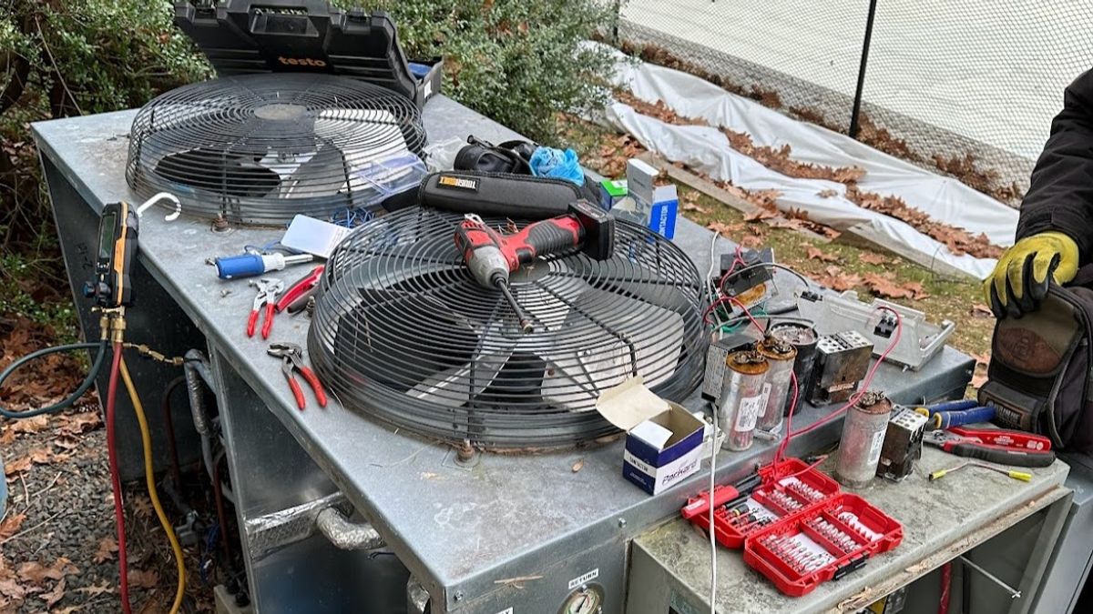 Art HVAC Technician Topping Off Refrigerant on a Commercial Chiller at a NYC Office Building Chiller Maintenance Site