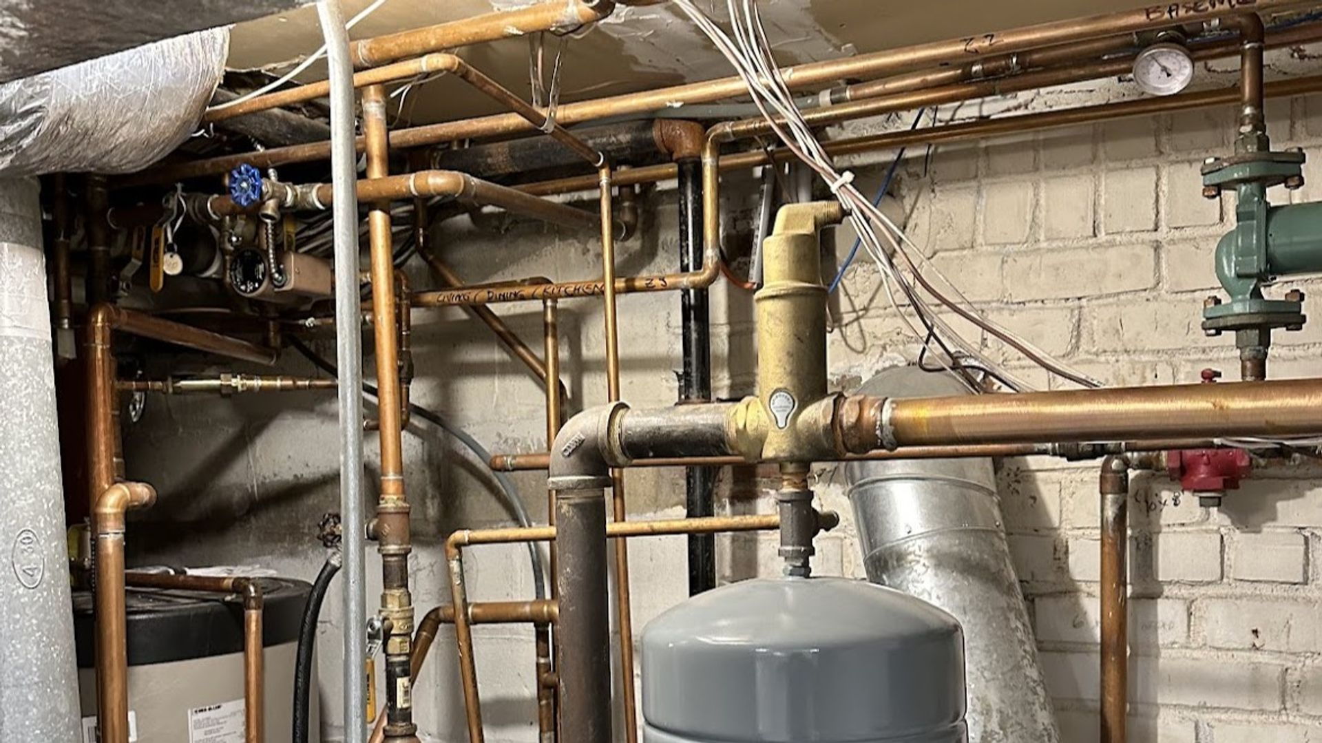 Art HVAC Plumber Installing Copper Appliance Piping to Commercial Cooking Equipment at a NYC Restaurant Kitchen