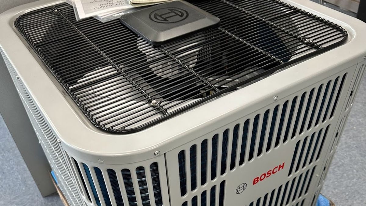 Art HVAC Technician Installing a New Residential Heat Pump System at a NYC Brownstone During Heating Cooling Upgrade